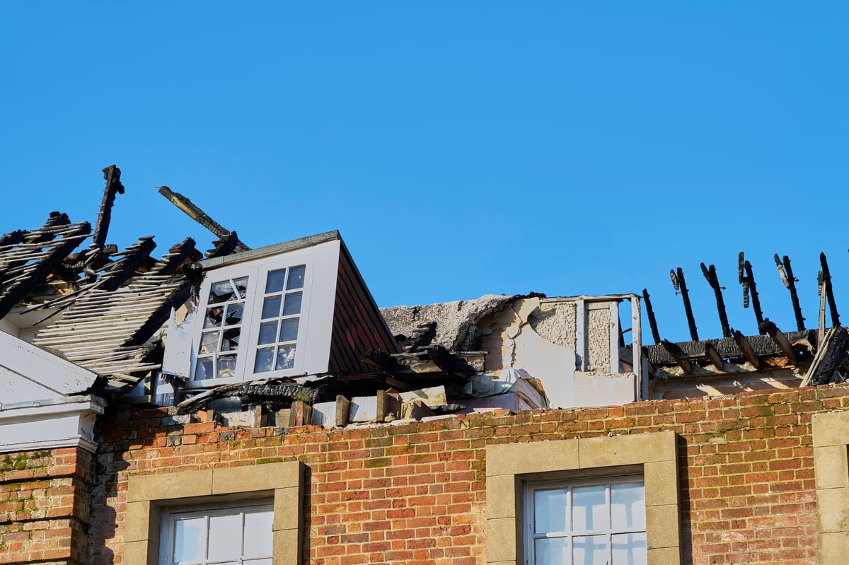 Close-up of soot and fire damage inside a kitchen subject to an insurance claim.